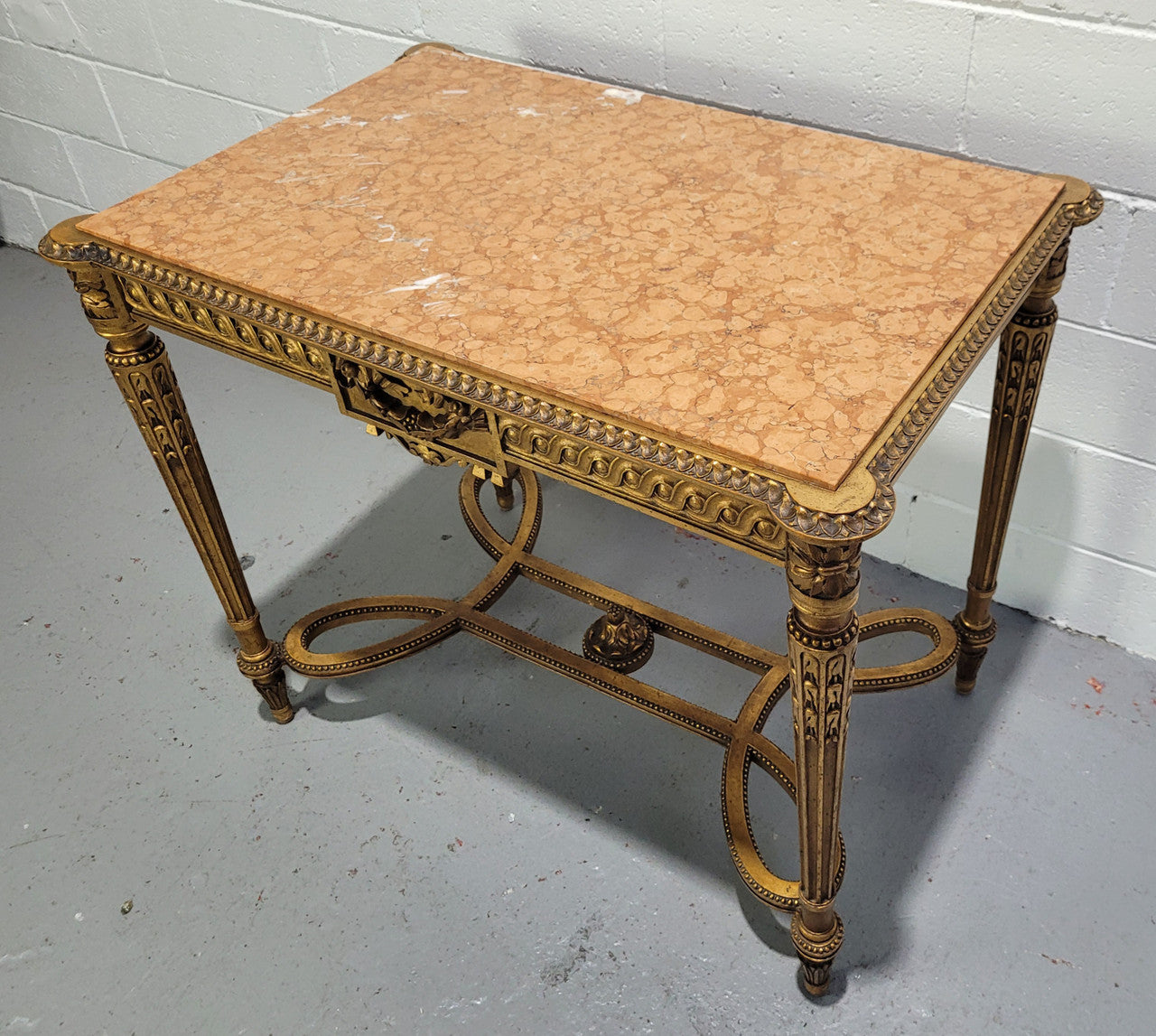 Antique French Louis XVI style gilt center table with a stunning marble top. Featuring stunning ornate carving and it is in great original condition. It has been sourced directly from France.