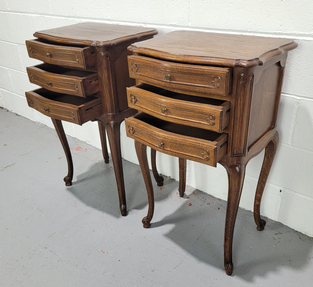 Lovely Louis XV style oak bedside cabinets with three drawers. In great original detailed condition.