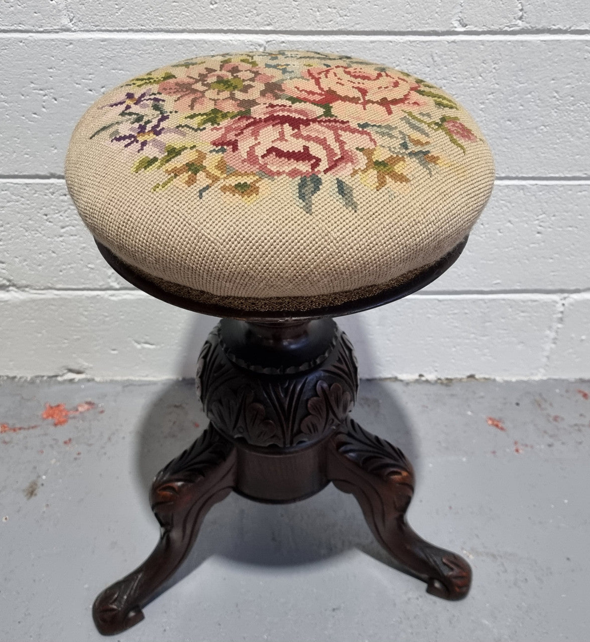 Beautiful Late Victorian Floral tapestry covered revolving piano stool. It is in very good original detailed condition. It has a original David Jones label underneath .