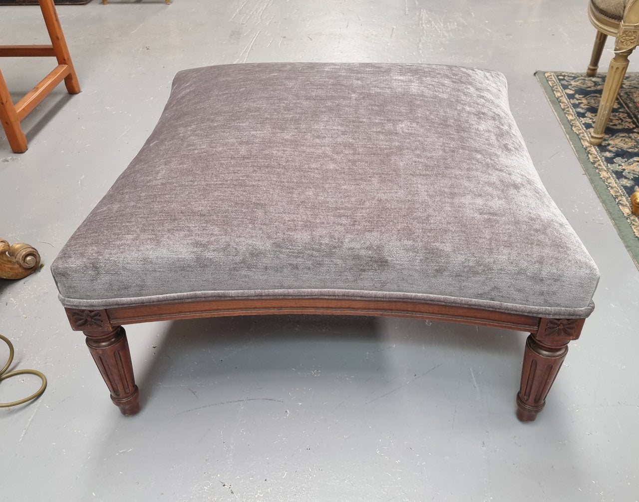 Amazing French Louis 16th Style large walnut footstool with new grey upholstery. Circa: 1900. In good detailed condition.