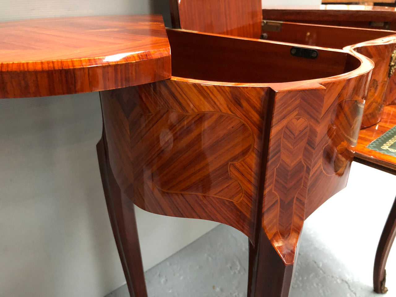 French Mahogany hidden dressing table with beautiful marquetry inlay. In good restored condition. Circa: 1950's