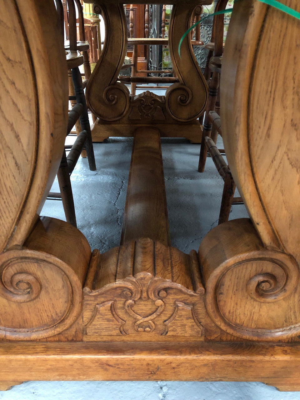 French oak fixed farmhouse table with a charming harp-shaped base. In good original condition and can seat 6-8 people. Circa 1930.