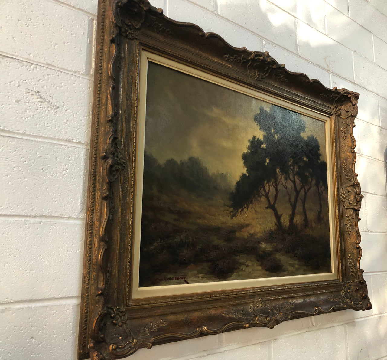 Sensational "Moody" oil on canvas landscape painting in a ornate gilt frame. In good original condition.