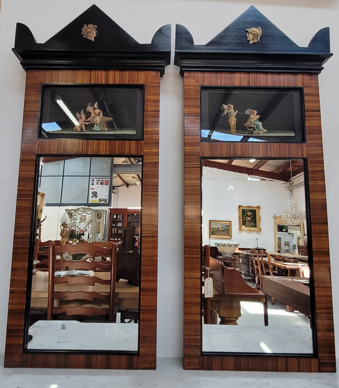Pair of Italian Empire style trumeau mirrors with original hand-painted watercolor cupid scenes. In good original condition.