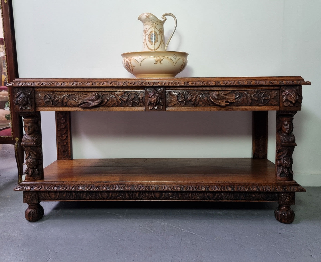 19th Century French Oak Henry the 2nd style console/side table/ TV unit with two drawer with beautiful carvings. It is in good original detailed condition.