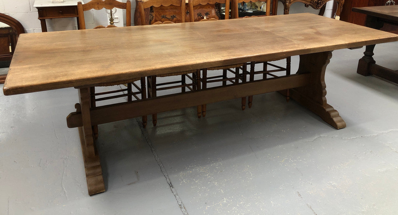 Lovely long French light oak Farmhouse table with a good thick plank top and beautiful stretcher base. Can seat 12 people very comfortable and is in good original condition.