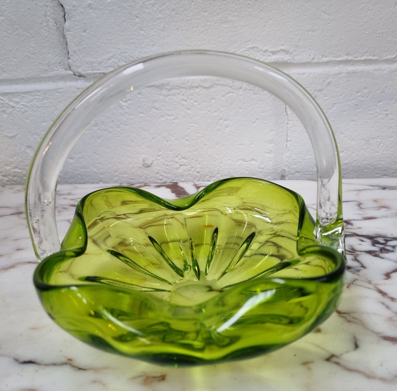 Delightful art glass vintage basket. Green glass bowl and clear handle.