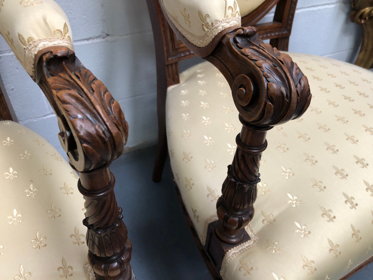 Beautiful pair of Vintage French Walnut Louis XVI style carved Fauteuils with lovely upholstery and wide seats . In good original detailed condition.