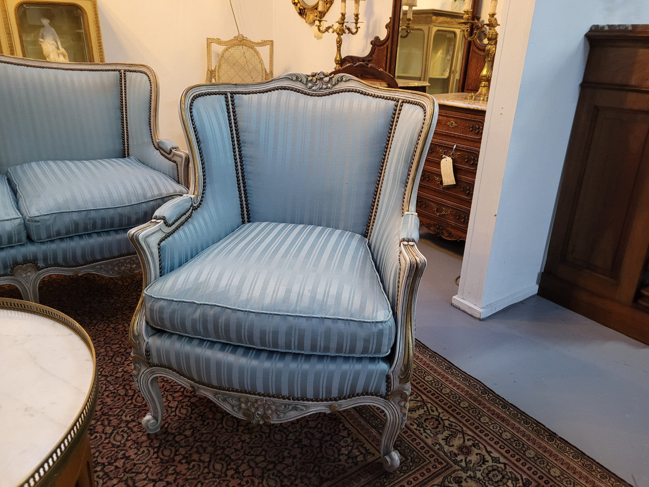 Well Proportioned Louis XV Salon Suite consisting of well proportioned 3 seater down cushioned, winged settee with 2 matching bergere chairs. All upholstered in stunning blue self stripe fabric. In excellent condition. Circa: 1930's.
