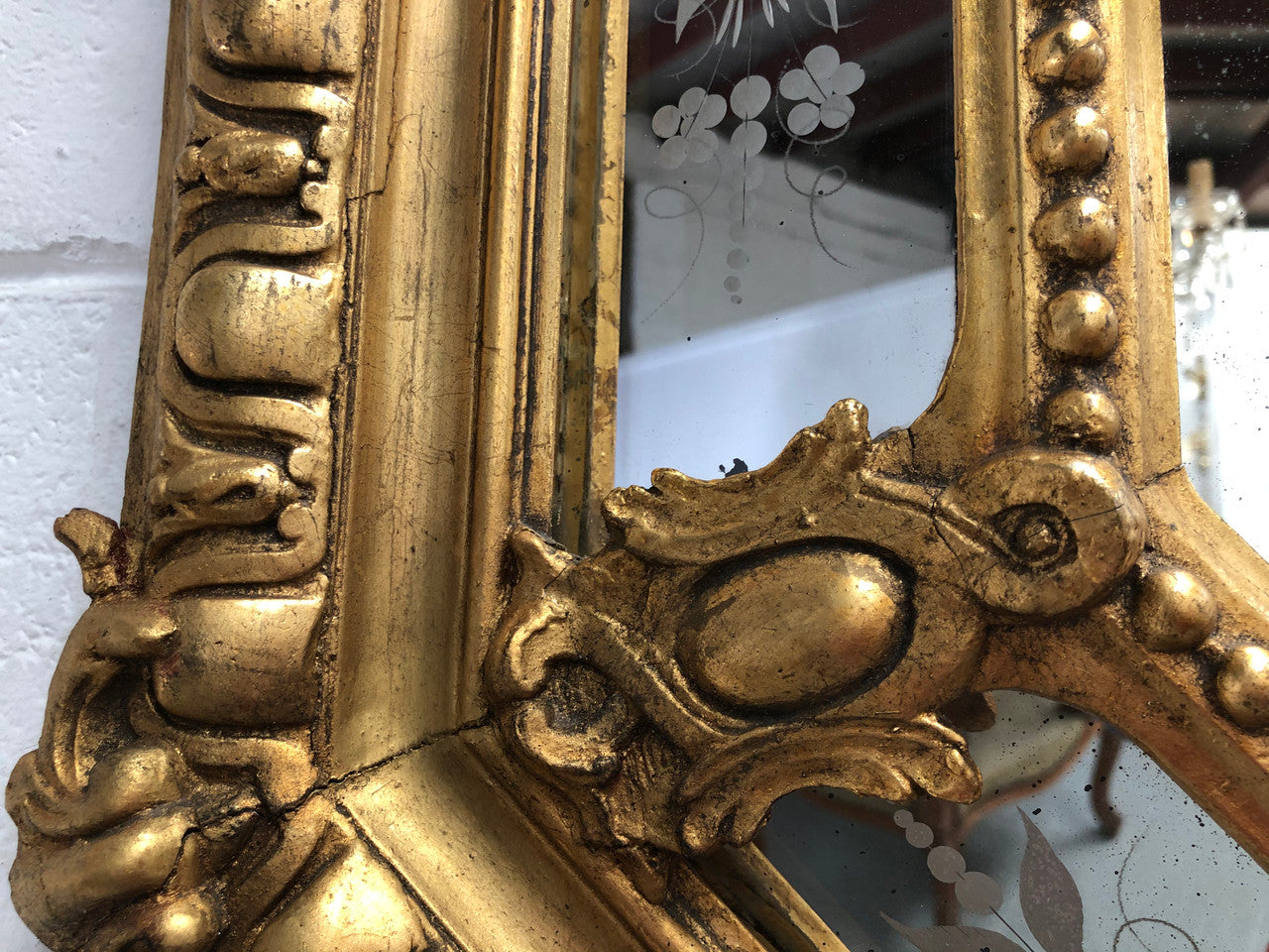 Early 19th Century gilt cushion mirror with acid etched floral pattern. In good condition. Please note original mirror does show some spotting commensurate with its age. Circa