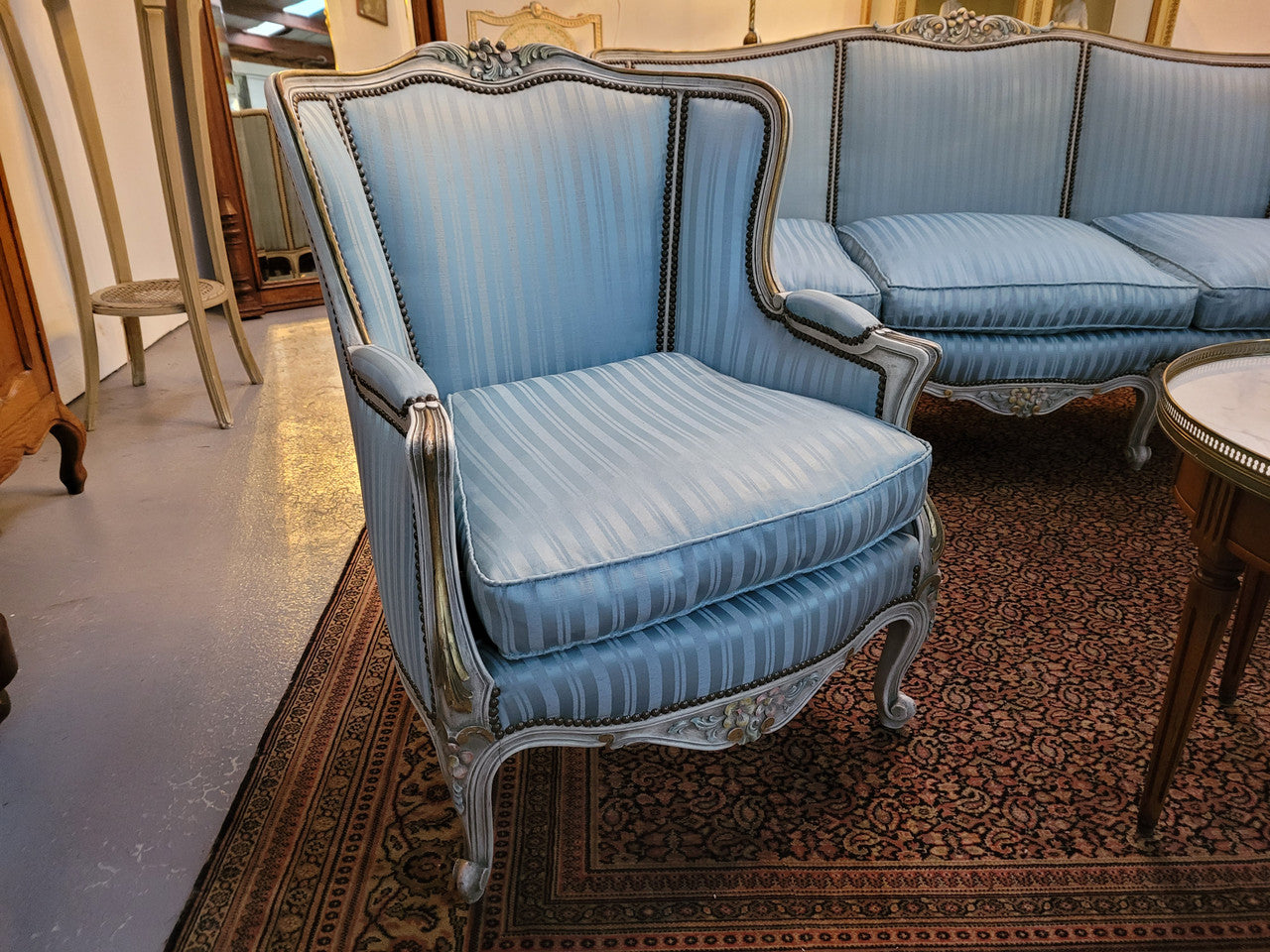 Well Proportioned Louis XV Salon Suite consisting of well proportioned 3 seater down cushioned, winged settee with 2 matching bergere chairs. All upholstered in stunning blue self stripe fabric. In excellent condition. Circa: 1930's.