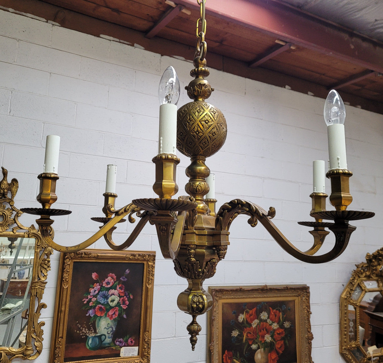 Stunning six arm French bronze chandelier. It can be used with or without shades. It has been fully rewired to Australian standards. It is in good original detailed condition.