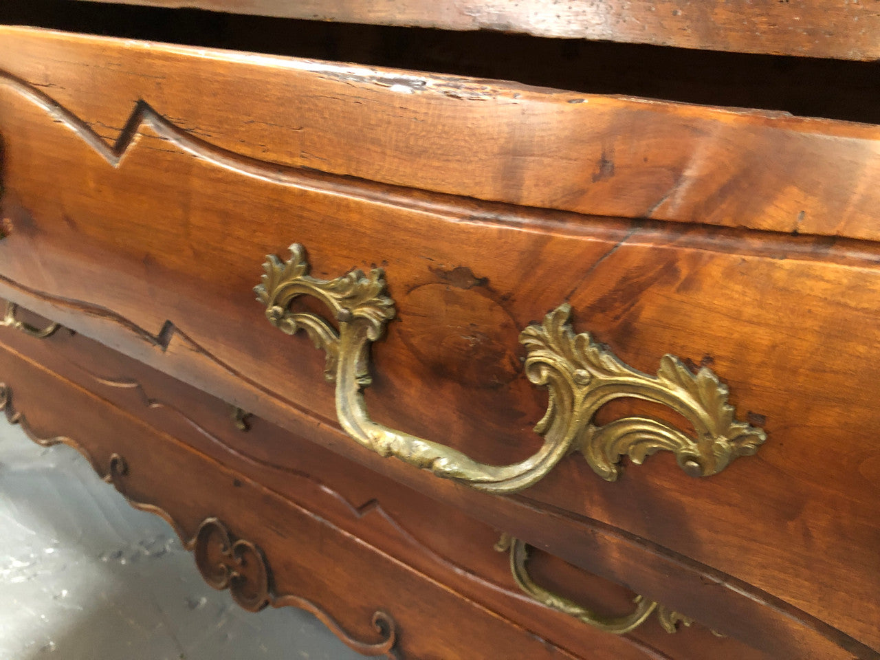 Beautiful 18th Century French all Cherrywood three drawer commode with beautiful ormolu mounts and handles. It is in good original detailed condition.