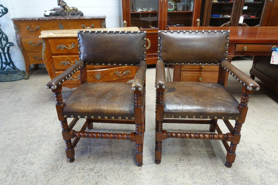 Here we have a fabulous set of six French oak rustic leather dining chairs with two carvers. Chairs are upholstered in brown leather and are very comfortable and solid. Is in very good original condition.