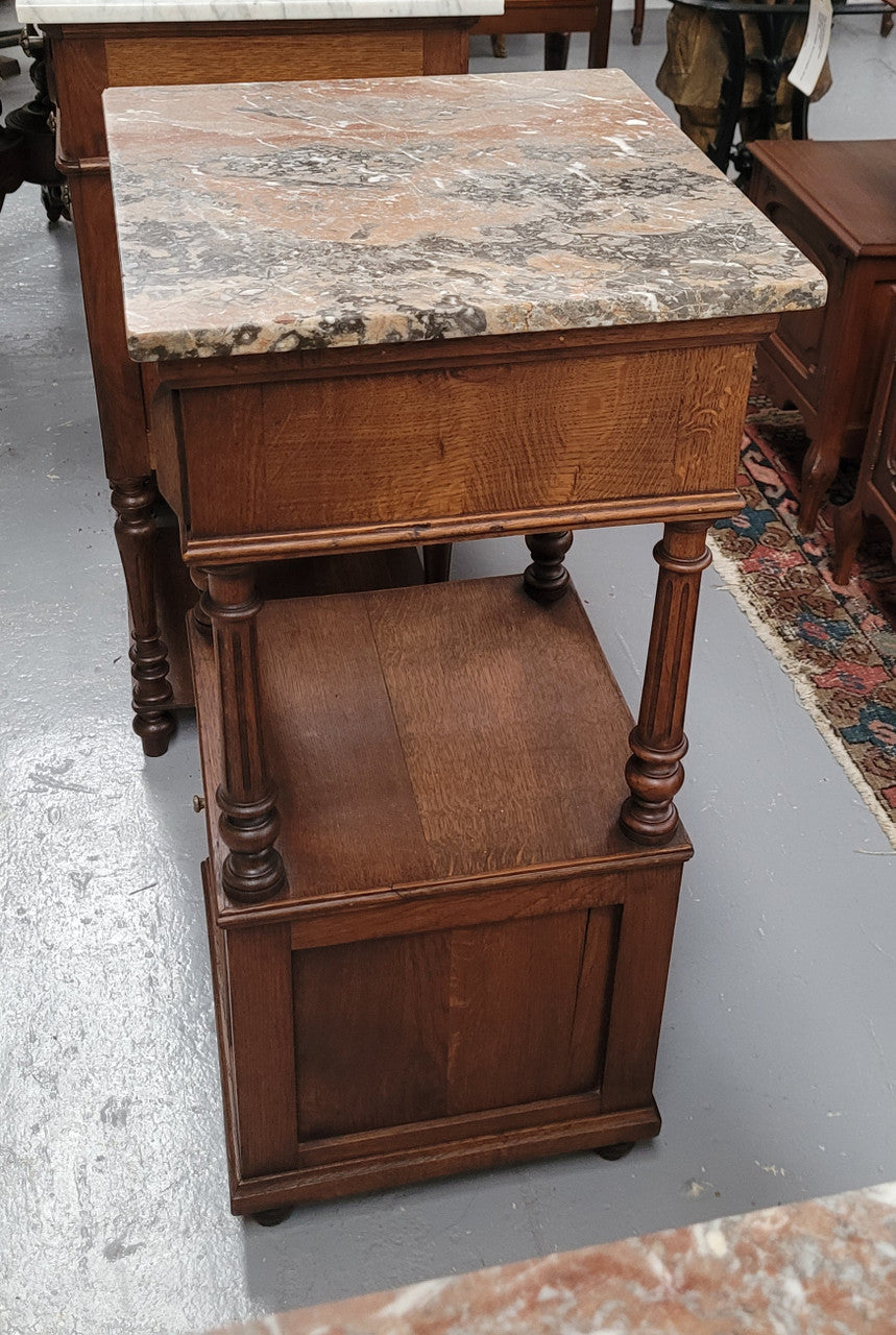 A Superb pair of Henry II style marble top French Antique bedside cabinets. They have a drawer at the top, an open shelf in the middle and a cupboard at the bottom. They have been sourced from France and are in good original detailed condition.