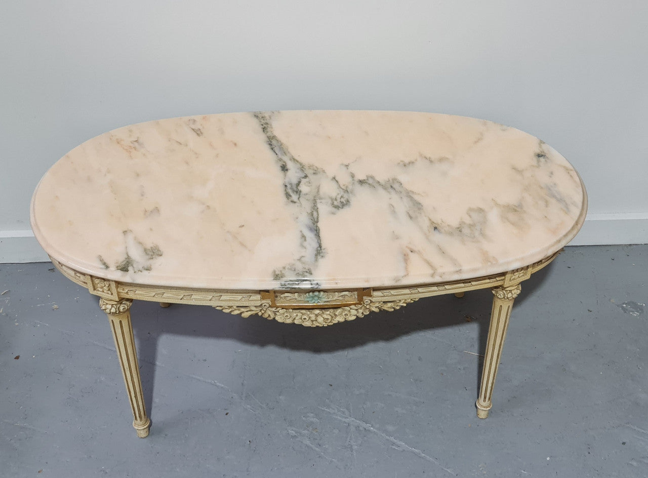 Charming painted Louis XVI style oval marble top coffee table. In good original detailed condition.