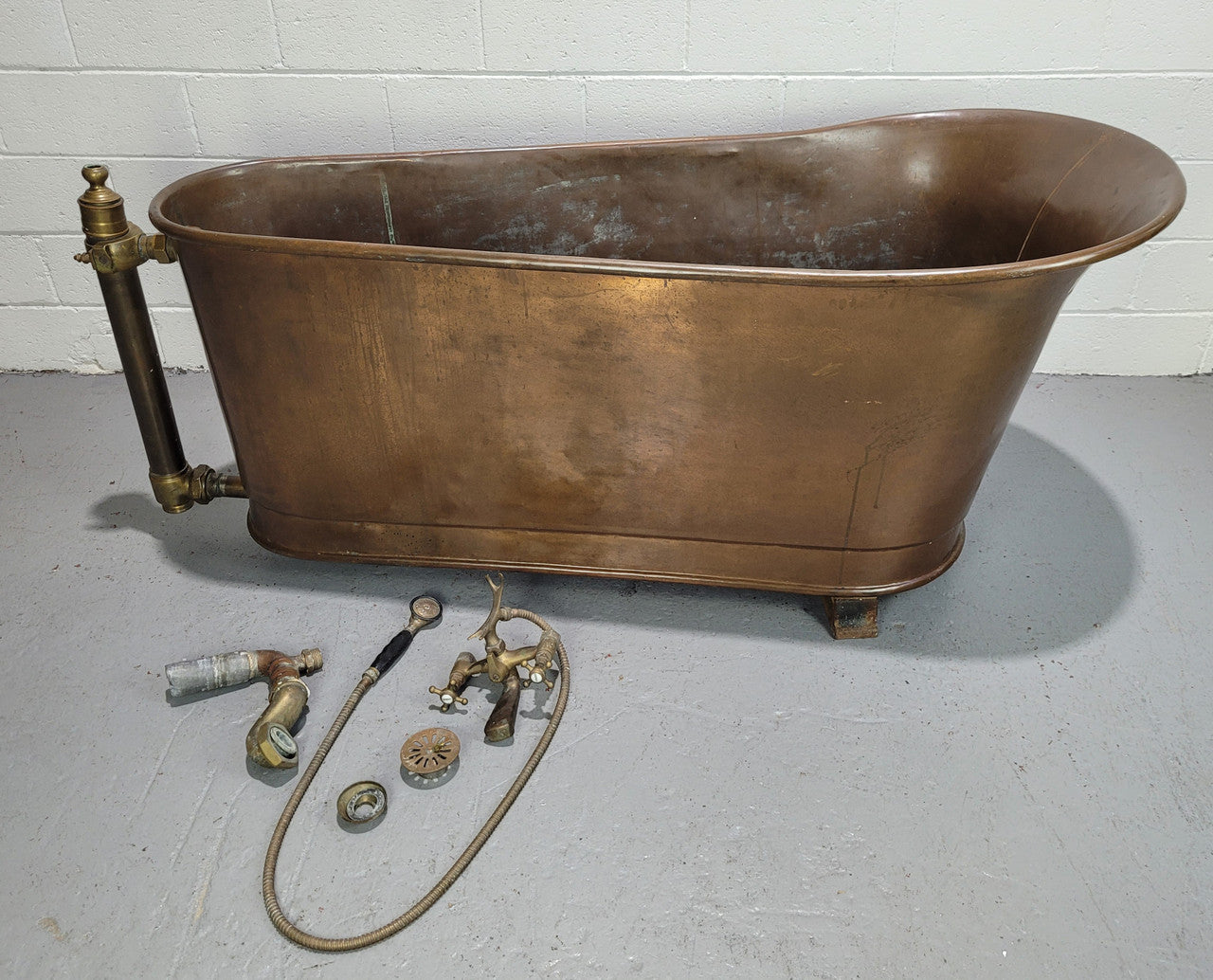 Sourced from France a rare full copper Antique bath tub on feet and includes an overflow, fittings, taps ect. In good original condition.