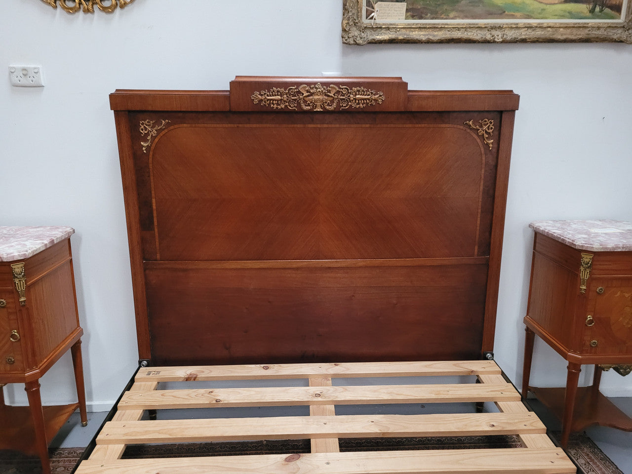 A high quality French Louis XV style bow fronted Queen size bed with marquetry inlay and ormolu mounts. In good original detailed condition. Circa: 1920