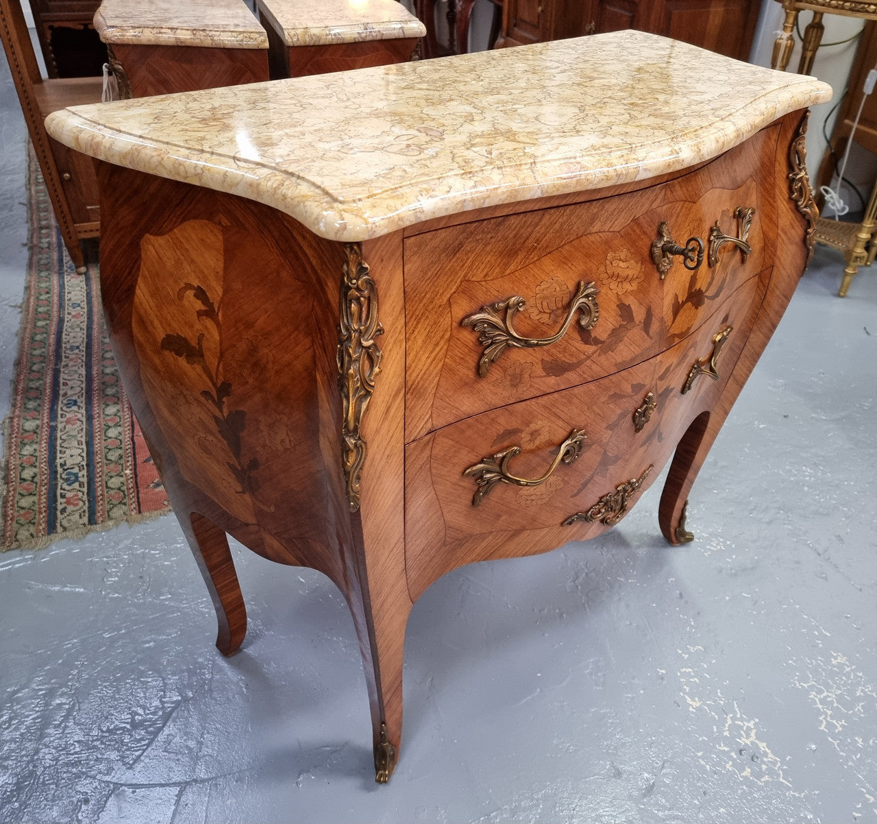 Fabulous French petite inlaid two drawer commode with ormolu mounts and lovely marble top. It is in good original detailed condition.