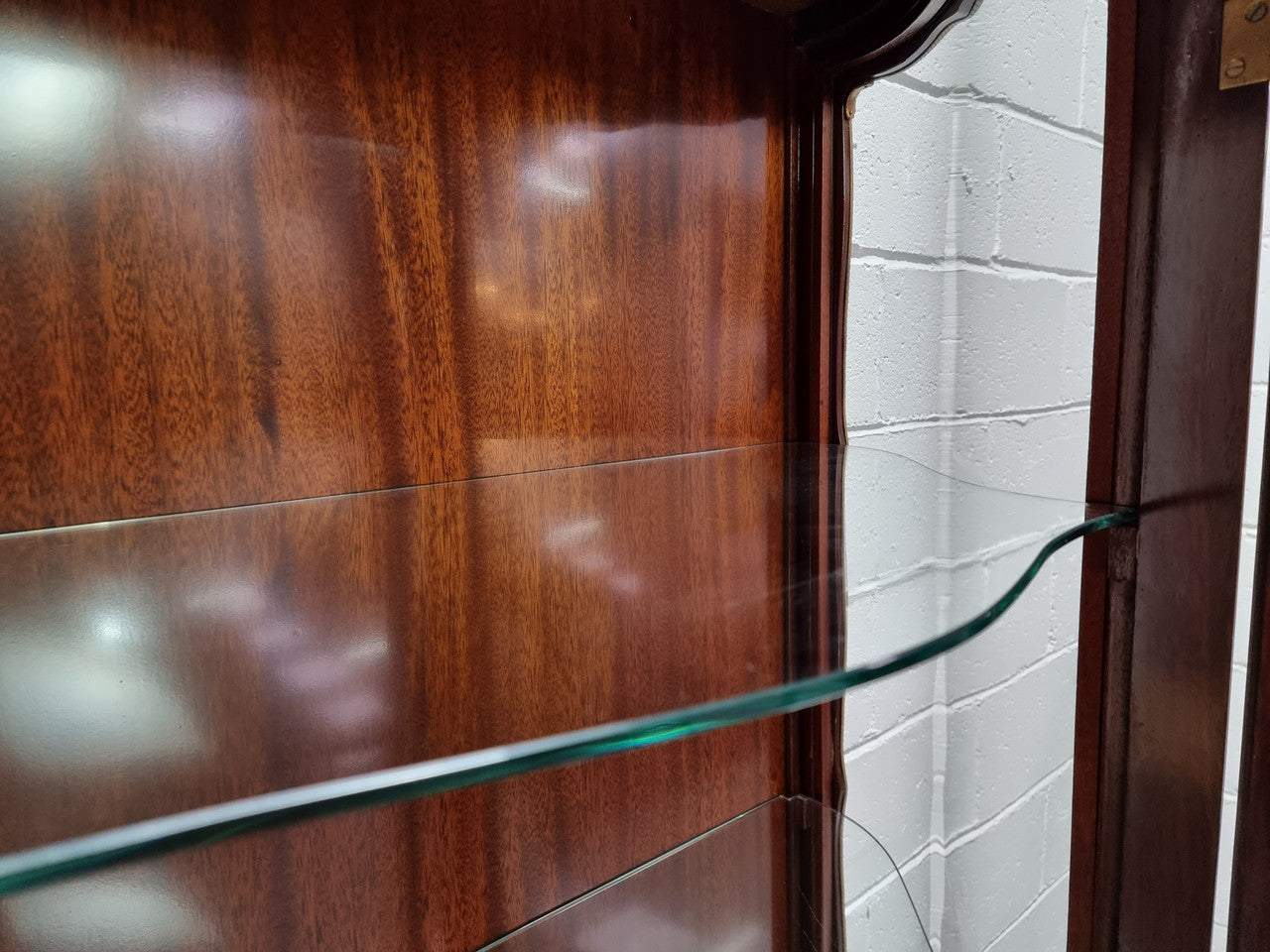 Grand French Walnut Louis XV style marble top vitrine. It has two glass shelfs and one mirrored shelf at the bottom and added storage at bottom. It is in good original detailed condition.