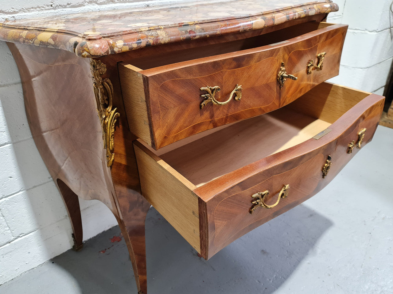 High quality French Mahogany Louis XVth style marble top commode. It has an eye catching marble top and is signed on body "J Bamelis". In very good original detailed condition.