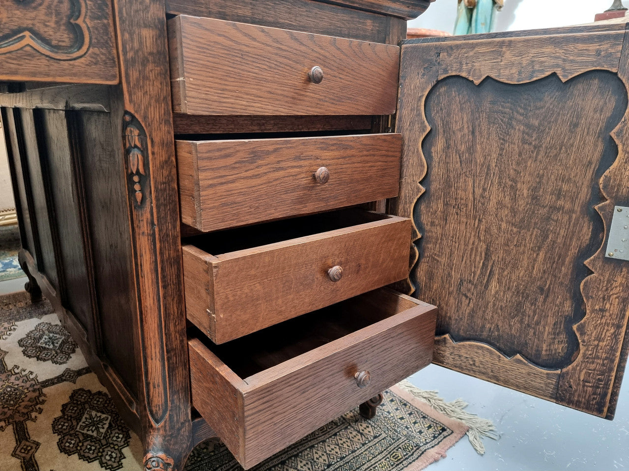 Fabulous Louis XV style French Oak beautifully carved full partners desk. Both sides have a functioning drawer in the middle and two cupboards either side. On both sides one cupboard door opens up to four smaller internal drawers. Plenty of storage space and a large top surface to work on. It is in good original detailed condition.