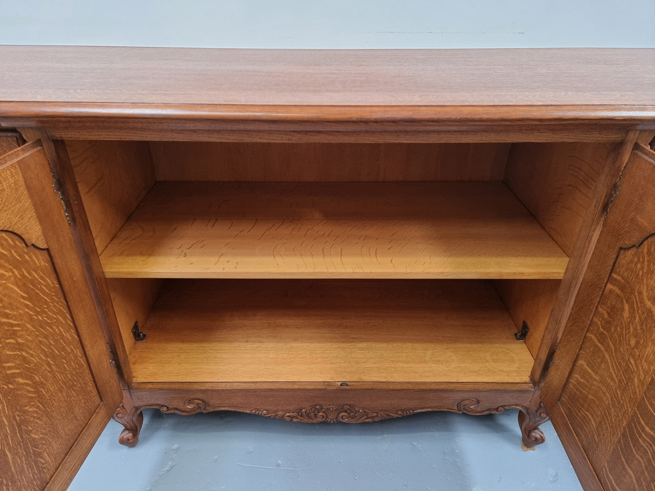 French oak large, beautifully carved four door sideboard with lockable doors and plenty of room for storage in good original condition.