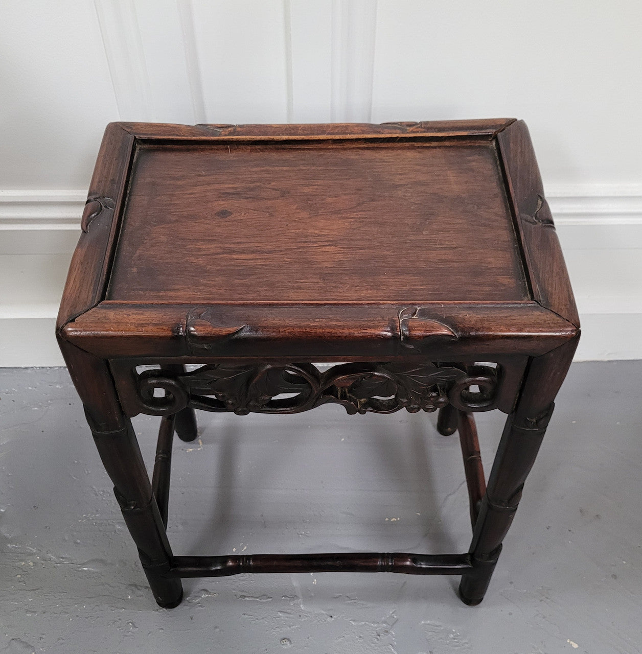 Chinese Rose wood occasional table. Nicely carved and could be used as a coffee table or and occasional table. It is in good original condition.