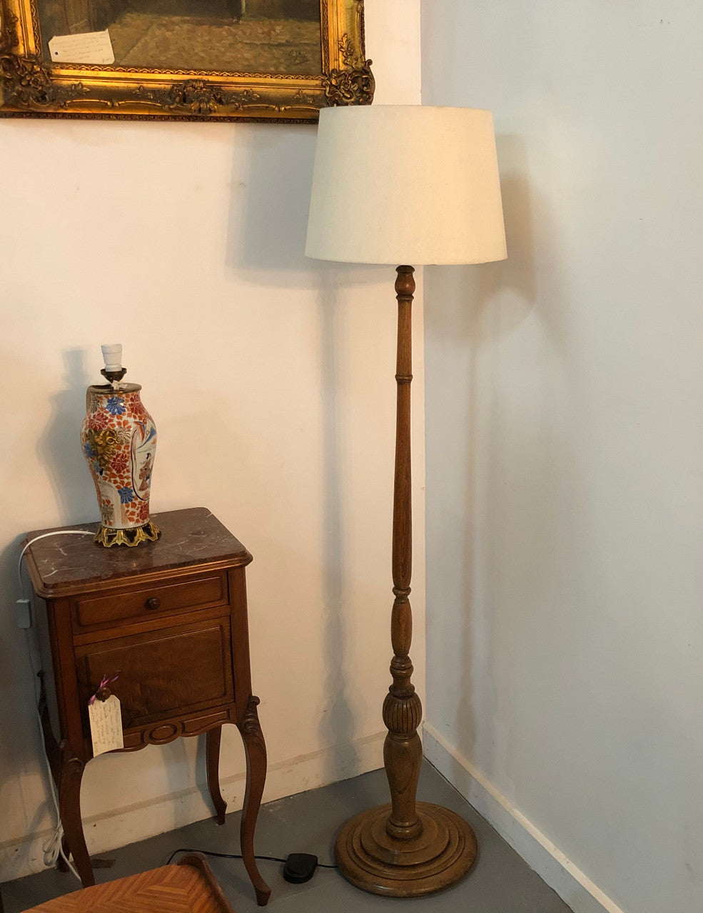 Tudor style Oak standard lamp, rewired and with foot switch. In good original condition.