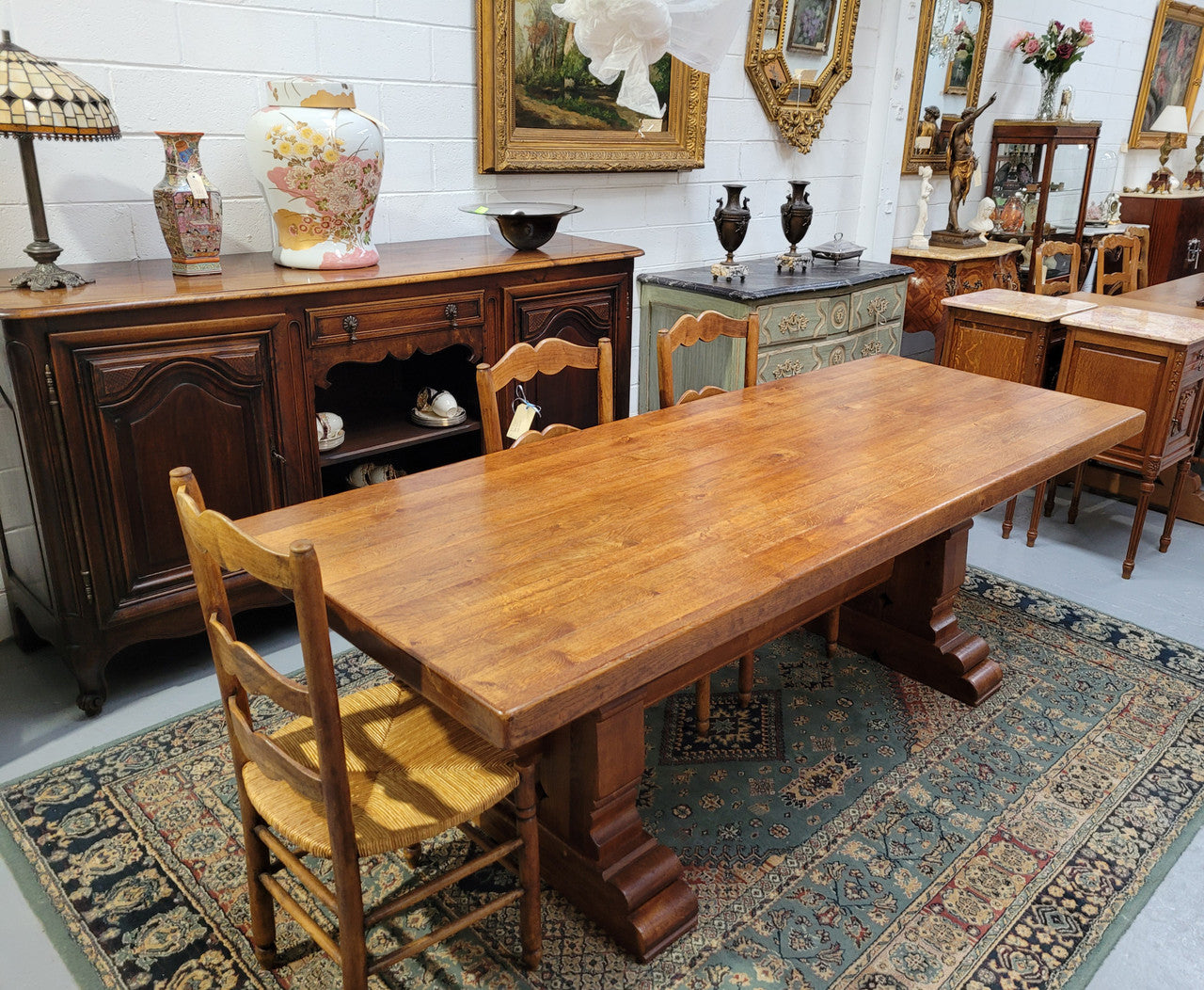 French Farmhouse table with a beautiful thick plank top and stretcher base. Can seat 8-10 people comfortably and is in good original detailed condition.