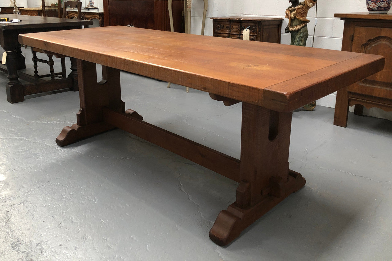 Lovely Oak French Farmhouse table with a thick plank top and lovely stretcher base. Can comfortable seat 8-10 people and is in good original detailed condition.