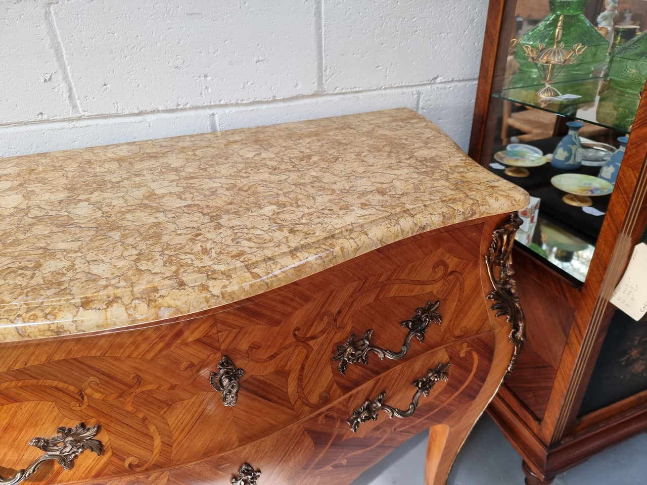 French marquetry inlaid Kingwood marble top commode. It has two drawers and beautiful mounts. Is in good original detailed condition.