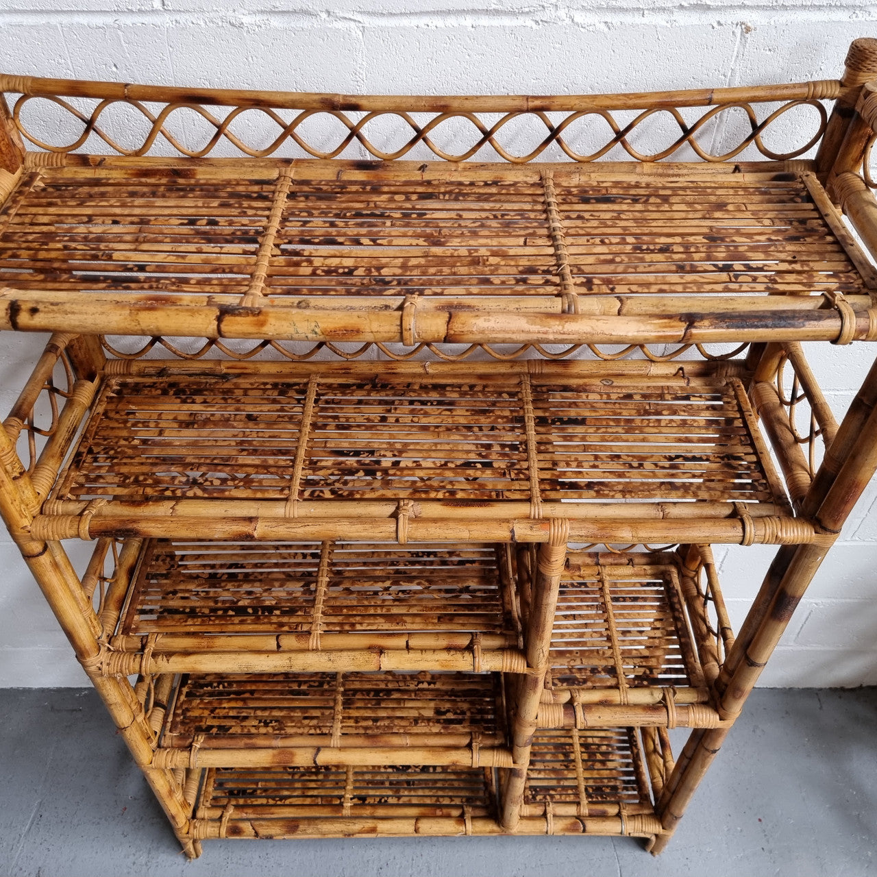 Vintage Tortoiseshell Bamboo Shelves. Good size unit with irregular shelves. It is in good original condition and it very solid.