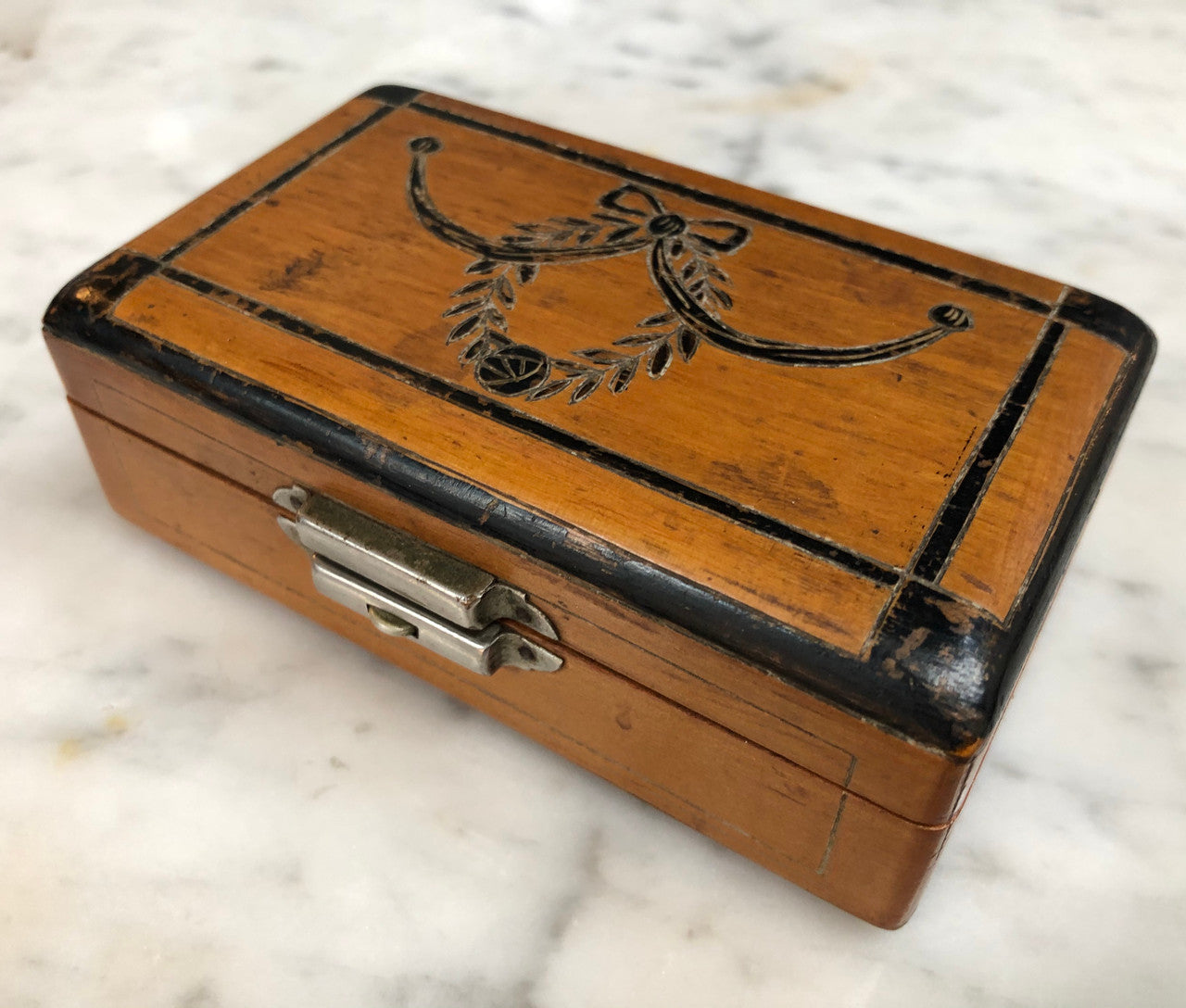 Victorian trinket box engraved with decoration . Is in good original condition.