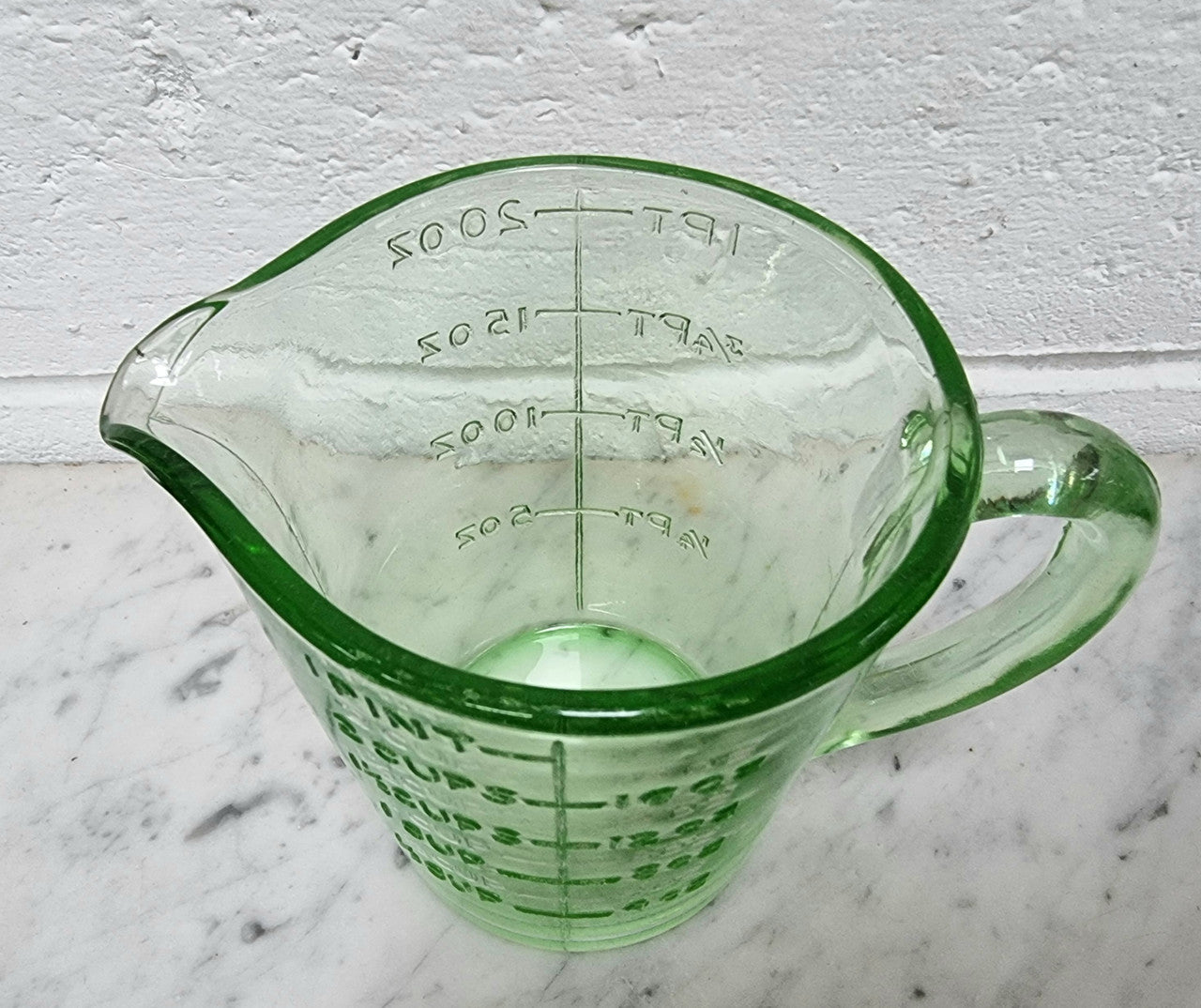 Vintage green depression glass jug. In good original condition.