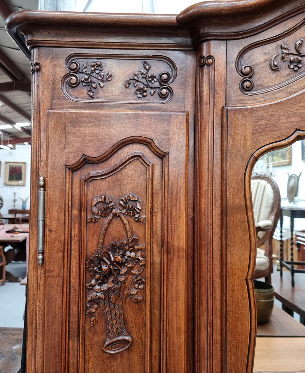 French Walnut Louis XV style three door armoire with 10 fully adjustable shelves in total spread over three sections, two drawers and a mirrored middle door. It has been sourced from France and in good original detailed condition.