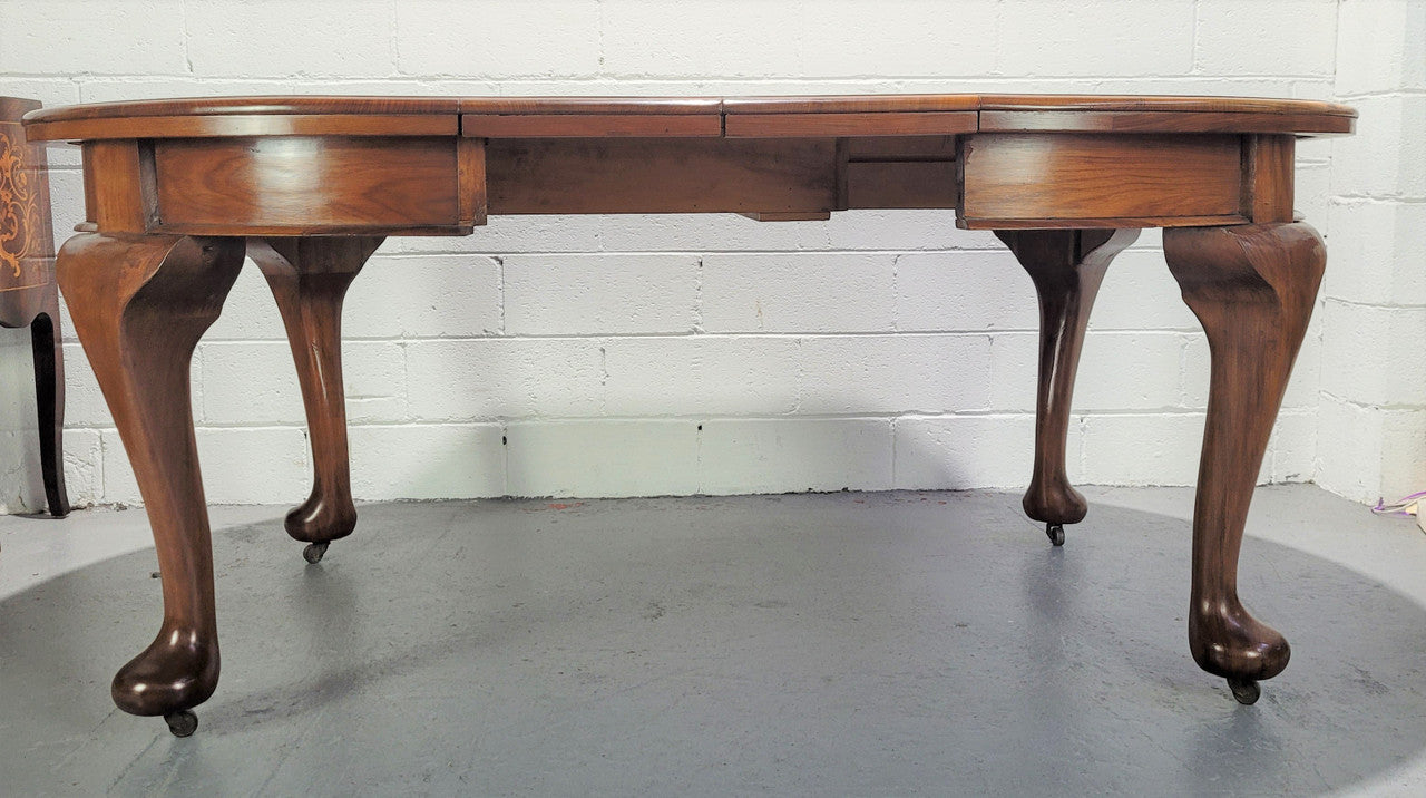 Period blackwood two leaf extension table. It can comfortably sit six people and eight when extend. It is in good original detailed condition.