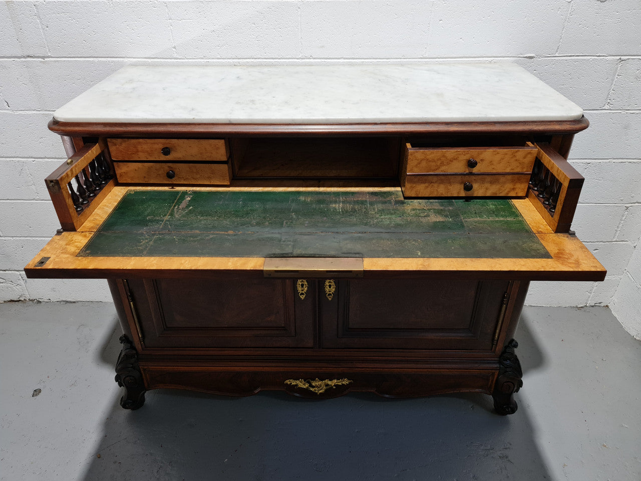 Stunning Rosewood Marble Topped Secretaire with two cupboards. Cupboards open to three fitted drawers and an additional secret drawer beneath the cupboard. All sitting on lovely carved legs and decorated with ormolu mounts. Circa: 1860. In good original detailed condition.