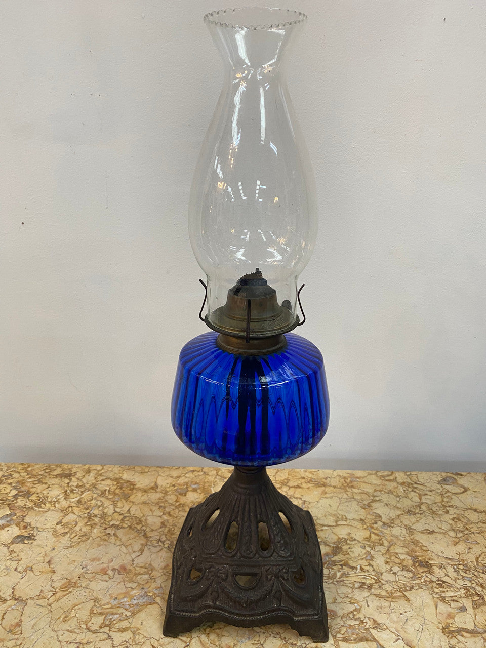 Victorian blue glass kero lamp with decorative metal base. Circa 1880's.