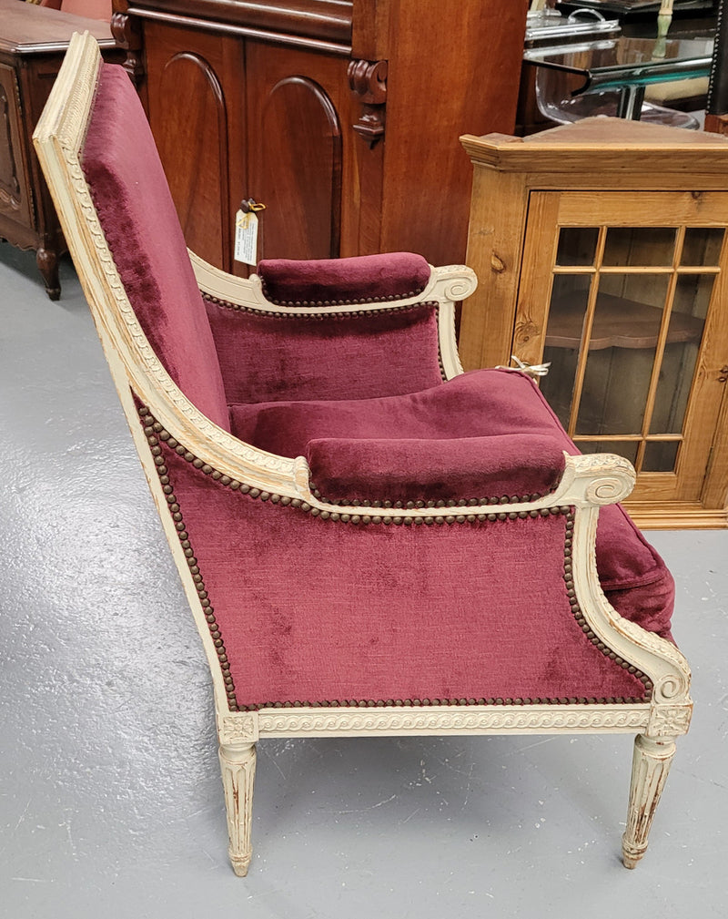Louis 16th Style high back upholstered chair with maroon velvet fabric, decorative carvings and original paint. It has been sourced from France and in good original condition.