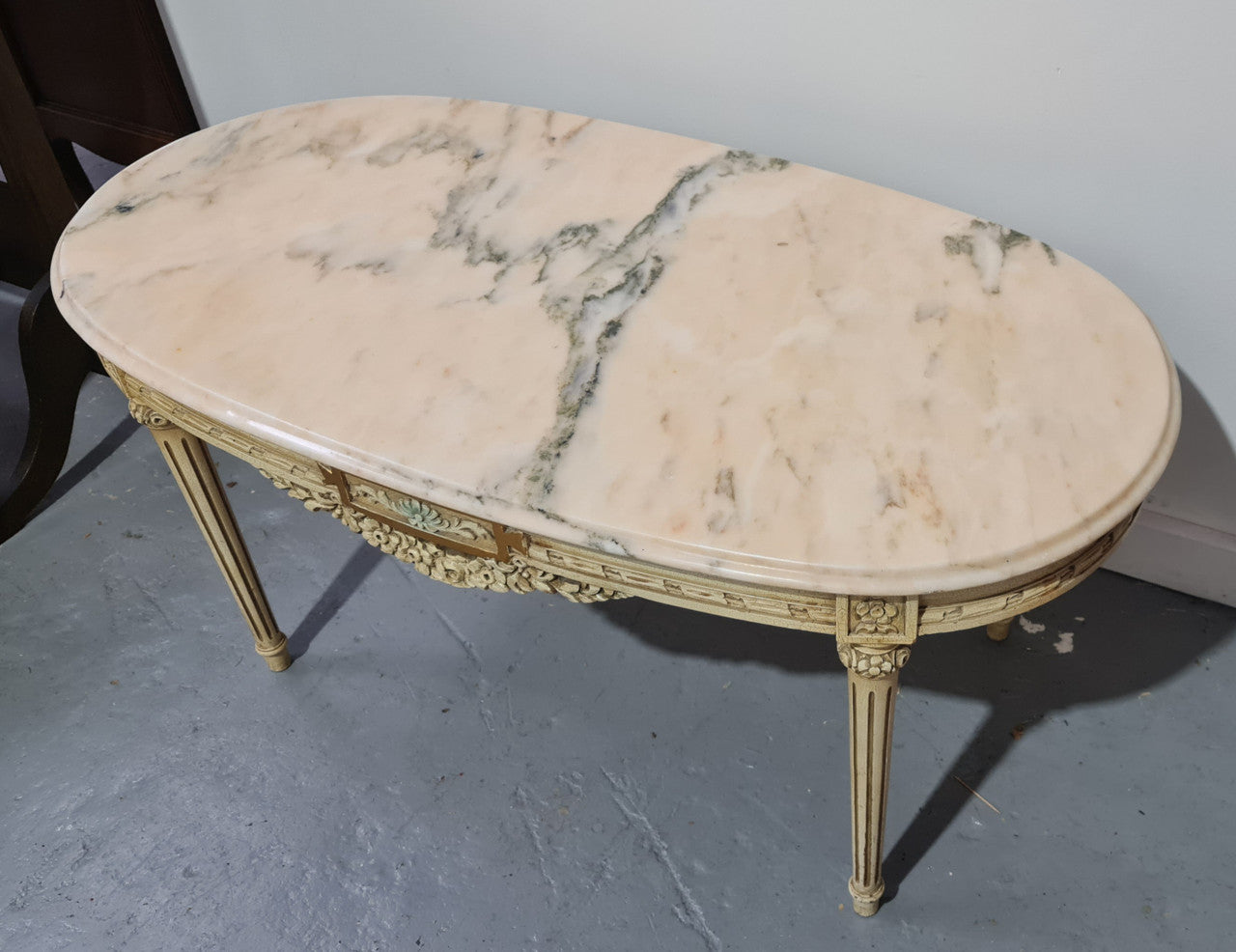 Charming painted Louis XVI style oval marble top coffee table. In good original detailed condition.
