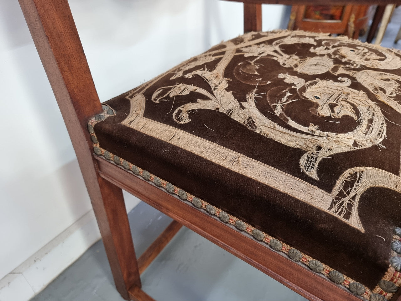 Beautifully carved Walnut Egyptian Revival armchair with amazing hand sewn Stumpwork embroidery coverings. In good original detailed condition.