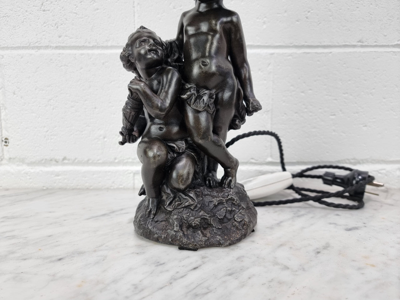 Antique French bronzed metal lamp with cherub's. in very good working original detailed condition.