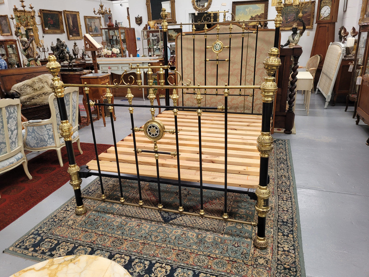 Rare Antique cast iron and brass Victorian queen size bed. Comes with custom made slats. It has been sourced locally and is in good original condition.