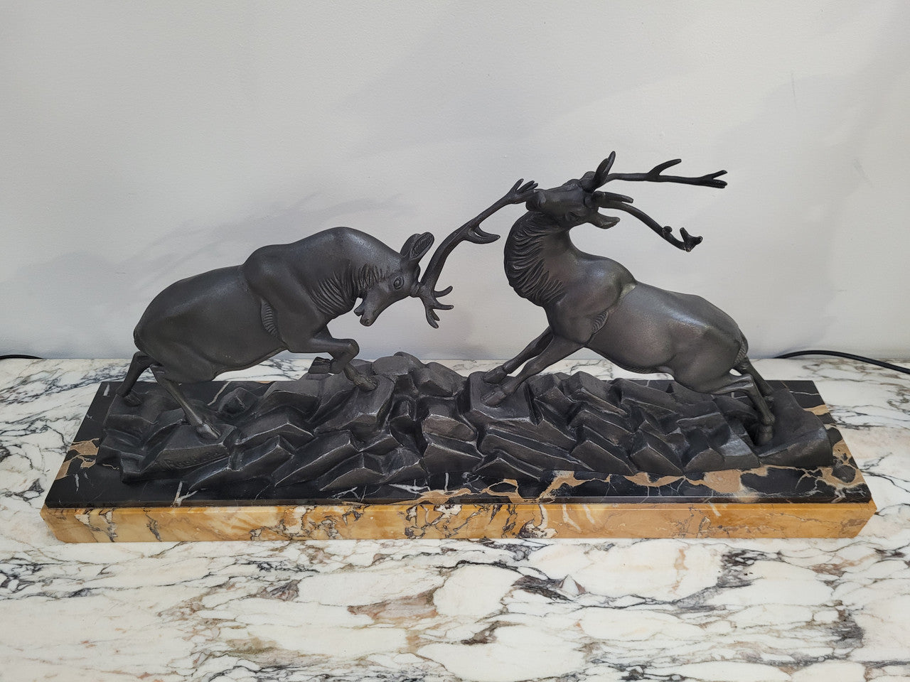 French Art Deco bronzed spelter and marble"Fighting Stags" statue by renowned artist and sculptor "Irenee Rochard".