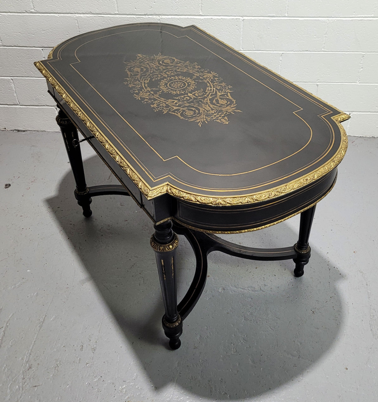 19th Century Napoleon III boulle ebonized centre table. Beautiful decorative mounts and has a drawer on one side. In good restored condition.