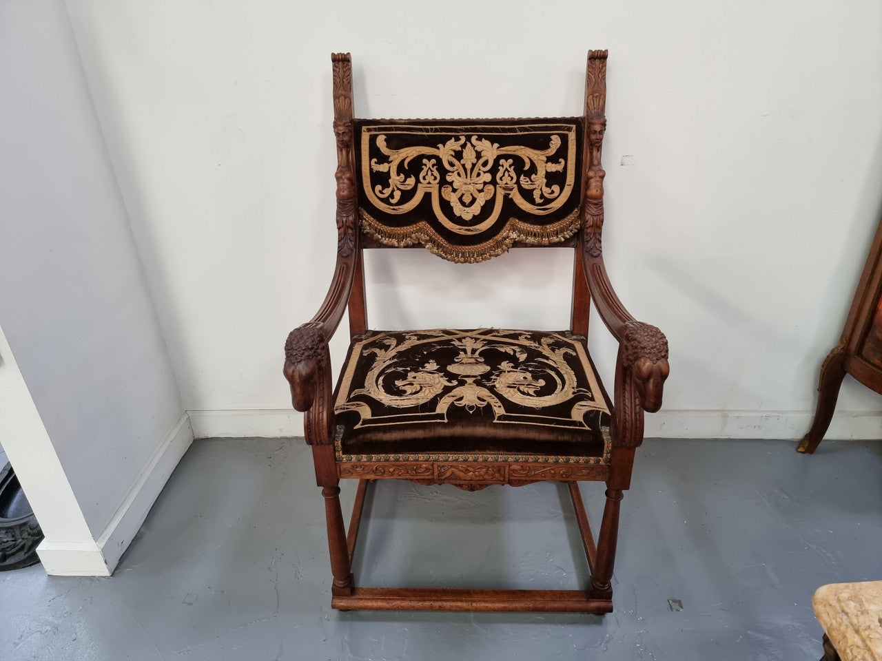 Beautifully carved Walnut Egyptian Revival armchair with amazing hand sewn Stumpwork embroidery coverings. In good original detailed condition.