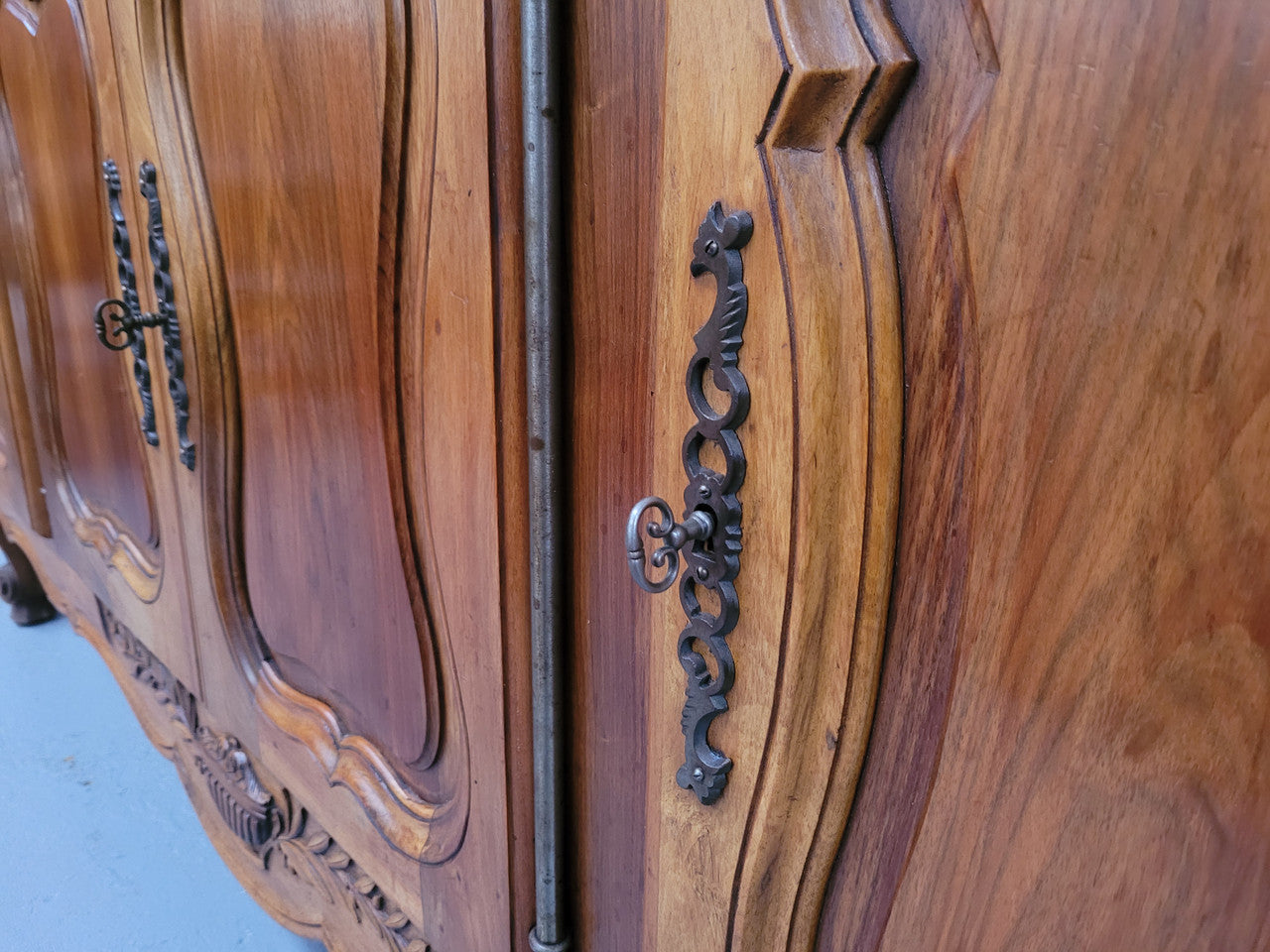 Magnificent French Walnut two-body four door display cabinet. Heaps of storage space with four glass doors at the top with shelves and four solid doors below also with shelving. It has been sourced from France and comes with a key for each door and all are lockable. In good original detailed condition.
