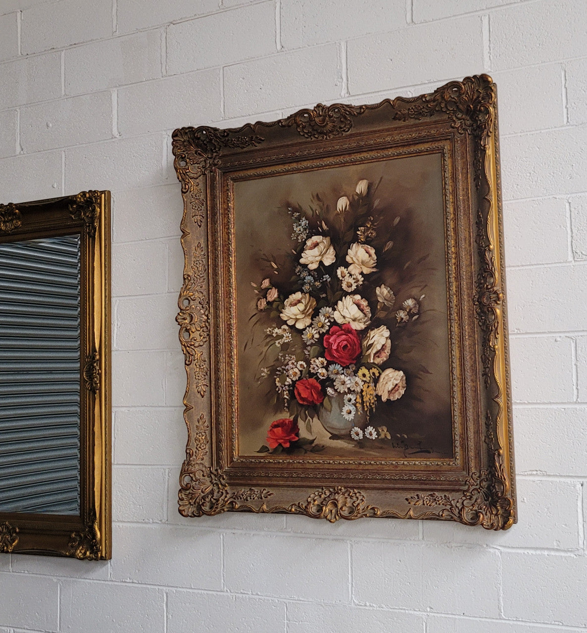 Attractive French floral oil on canvas - signed. Mounted in a stunning patterned gilded frame. It is in good original detailed condition.