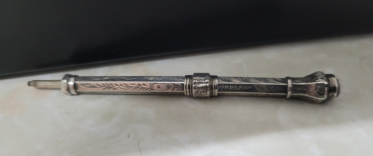 Interesting sterling silver and amethyst propelling and extending pencil. In good original condition, please view photos as they help form part of the description.